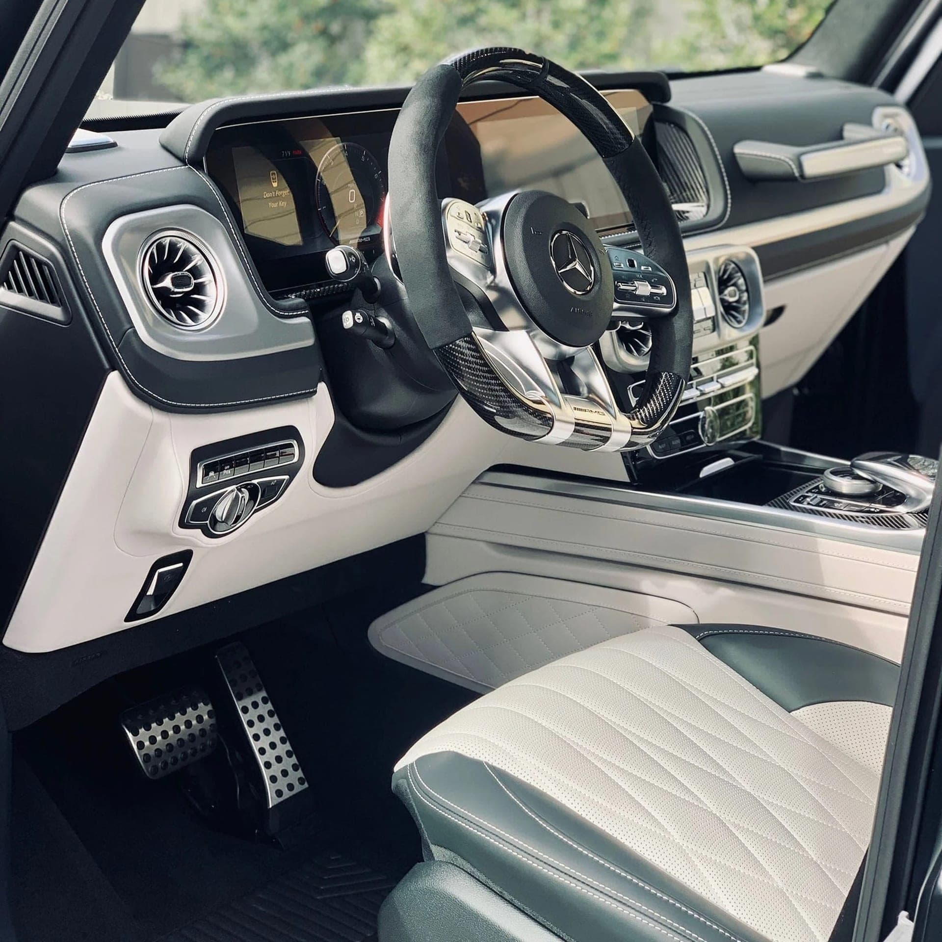 Pristine white-and-black Mercedes G-Class interior after a detail